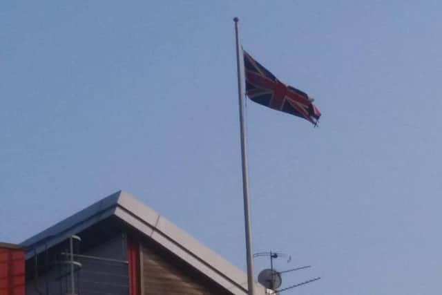 The Union flag on top of the fire station is being flown upside down.