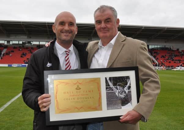 Colin Douglas is inducted into the Doncaster Rovers Hall of Fame by vice chairman Andrew Watson. Photo: Phil Ryan