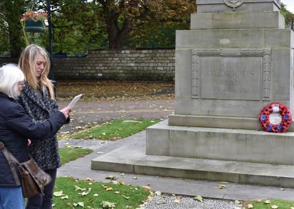 Vicky Siviter, project team and Jean Walker, project volunteer, test the new App at Doncaster War Memorial