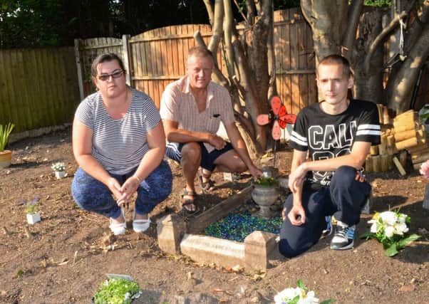 Julie Morris, Christopher Shackshaft and Stephen Morris, pictured by the new memorial garden that has been created within the grounds of St. Michael's church yard for all the children who died in the 1930's. Picture: Marie Caley NDFP St.Michaels MC 3