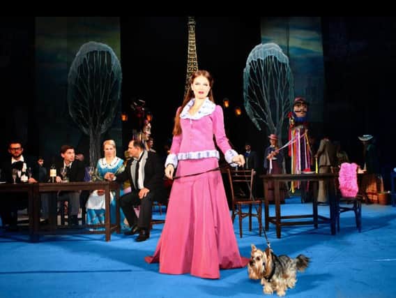 Musetta on stage with a dog in La Boheme