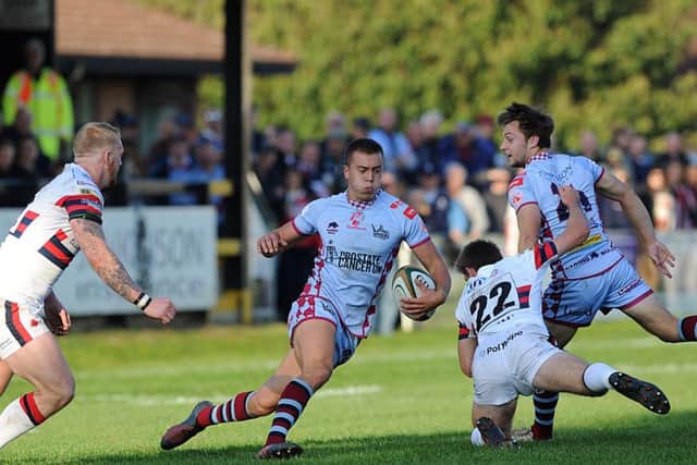 Titans' Lloyd Evans on his way to a 24-point haul in the B&I Cup win over Knights.  Picture Scott Merrylees
