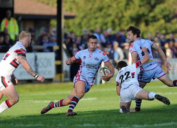 Titans' Lloyd Evans on his way to a 24-point haul in the B&I Cup win over Knights.  Picture Scott Merrylees