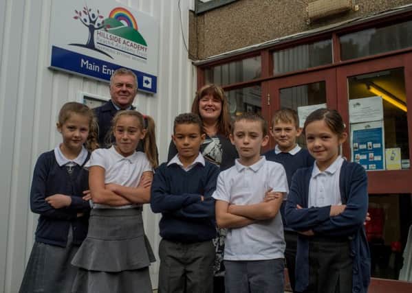 Paul Moffat, Doncaster Childrens Services Trusts CEO, with Mrs Michelle Walton (Principal at Hillside Academy) with pupils