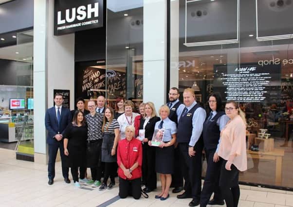 Staff at Frenchgate Shopping Centre outside of one dementia friendly store, Lush