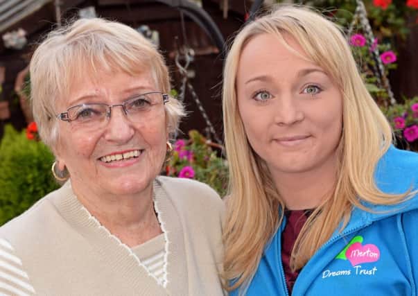 Brigitta Barton was diagnosed with Cancer aged 73 after she requested a Mammogram. Women over 70 currently stop having compulsory Mammograms under NHS guidelines. Brigitta wants to raise awareness and urge women to get checked. She is pictured with her grandaughter Claire Graham. Picture: Marie Caley