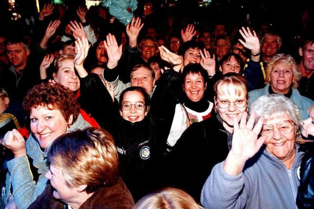 The crowd get into the swing of things as Chris De Burgh plays a concert in the car park of Asda, Bawtry Road, Doncaster.