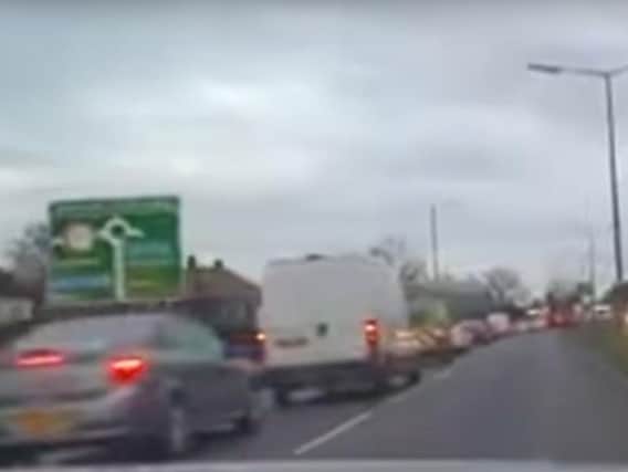 The right hand lane is totally empty while the left hand side of Wheatley Hall Road near Clay Lane is snarled up with traffic. (Photo: YouTube).