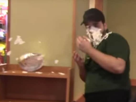 A scene from the custard pie attack video. (Photo: YouTube).