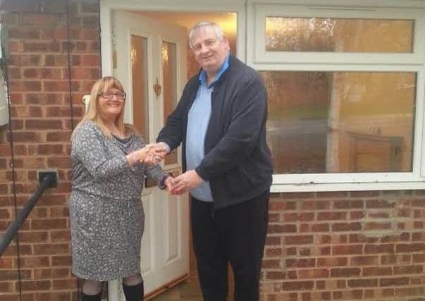 Jo Howe, estate agent for St Leger Homes, handing over keys to the first property for veterans to Steve Bentham-Bates, chief executive of Help 4 Homeless Veterans.