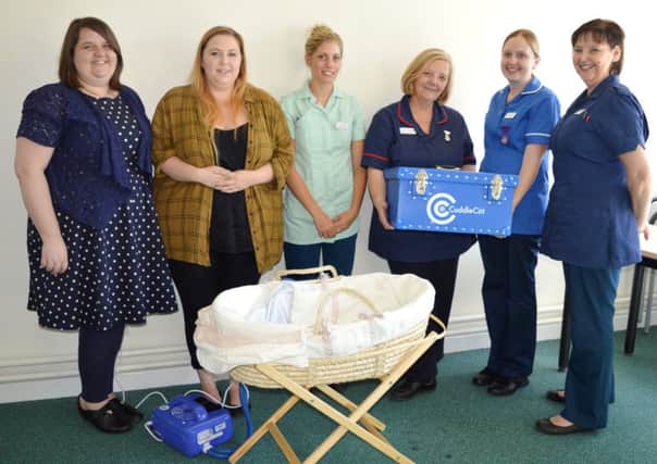 Cot donation buys precious time for local families