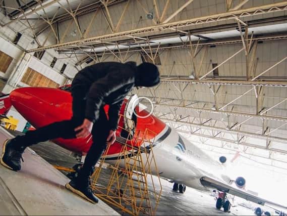 A police investigation is underway after group of urban climbers who call themself 'Nightscape' videoed themselves sneaking into Doncaster and climbing into the cockpit of a jumbo jet. Picture: YouTube