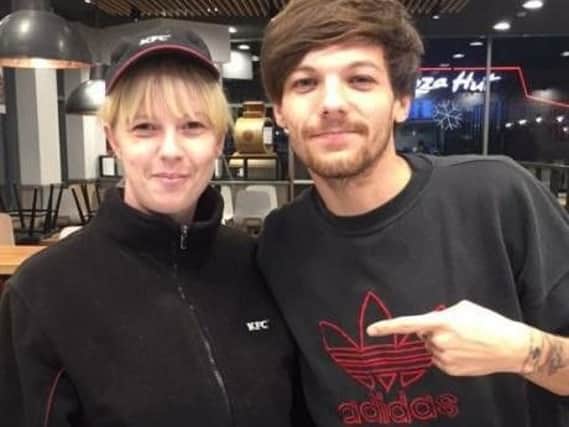 Louis Tomlinson visits the Doncaster Lakeside branch of KFC. (Photo: Twitter).