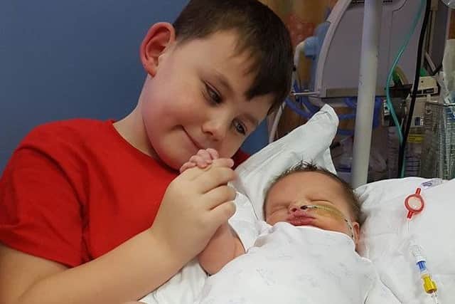 Baby Daniel Bostock, of Doncaster, with big brother Luke, aged 5. Daniel was born on November 10 2016 and suffered severe brain damage after he stopped breathing for 25 minutes after birth, but he has survived against the odds.
