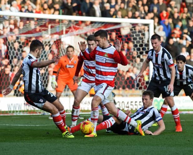 Mathieu Baudry battles for possession
