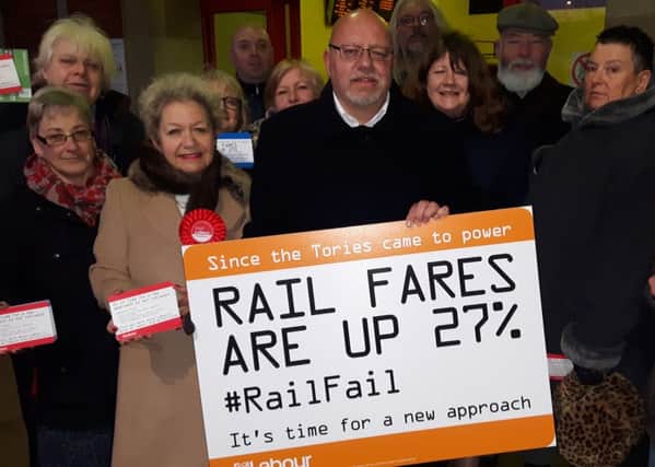Doncaster Central MP Rosie Winteron and Doncaster councillor Glyn Jones campaign with other Labour party representatives against increases in rail fares at Doncaster train station on Turesday January 3 3017.