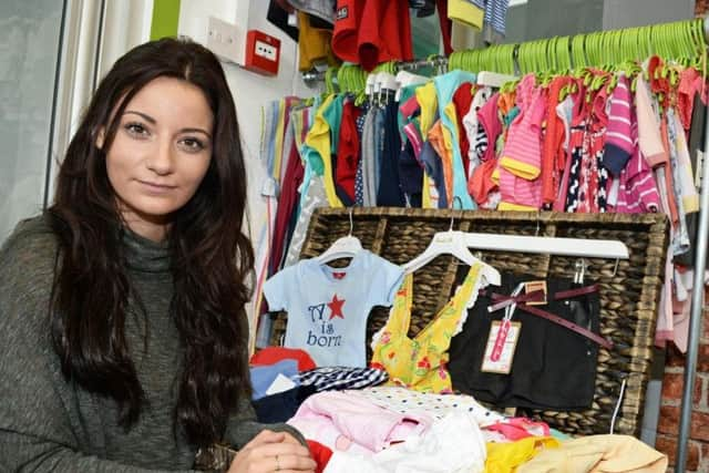 Frances in her children's clothing shop.