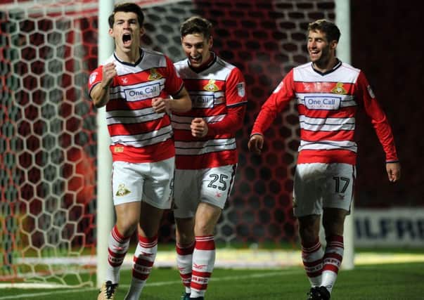 Sky Bet League Two.
Doncaster Rovers v Portsmouth.
Rovers John Marquis celebrates scoreing the opening goal with Conor Grant.
5th January 2017.
Picture : Jonathan Gawthorpe
