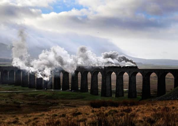 The Winter Cumbrian Mountain Express steams over the Ribblehead Viaduct on the Settle Carlisle line, hauled by the double headed Black 5s 44871 and 45407 instead of the Flying Scotsman after it broke down mid week.  23 January 2016.  Picture Bruce Rollinson