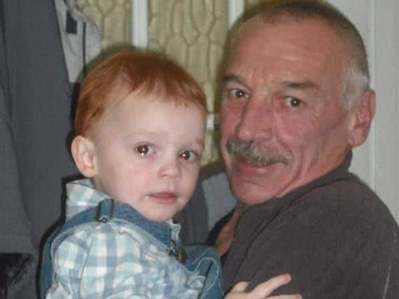 Mr Chambers with his grandson Lucas, now six. (Photo: SWNS).