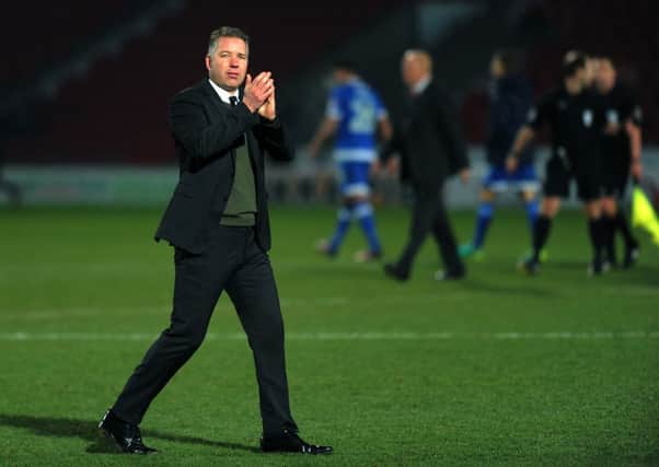Darren Ferguson acknowledges Rovers' support after the win against Portsmouth.