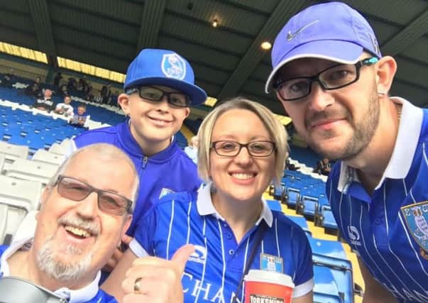 Sheffield Wednesday fan Pete James with his nephew Aron, daughter Sarah and her partner Lee. Pete was 66 when he died of liver cancer. It was his dying wish to see all the professional football clubs in South Yorkshire before he died.