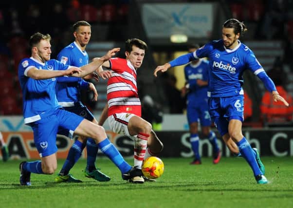 John Marquis battles for possession in last week's win against Portsmouth.