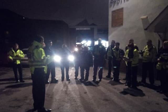 Officers are briefed ahead of this morning's swoop.
