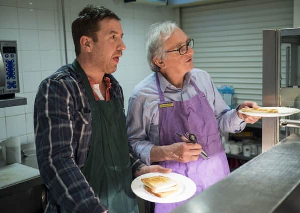Former employee Joe Llander and volunteer Michael Jarratt help out in the Archer Project kitchen.