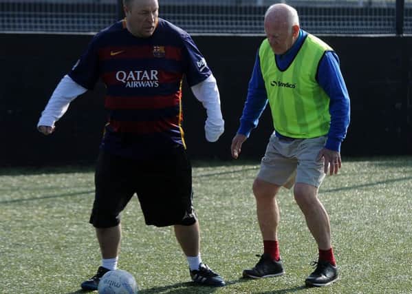 Ex Doncaster Rovers player Lawrie Sheffield defends against Nidge Roe at walking football. Picture: Andrew Roe