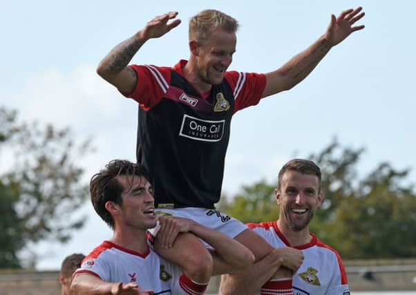 James Coppinger pictured at Morecambe earlier in the season - where he made his 500th appearance for Doncaster Rovers.