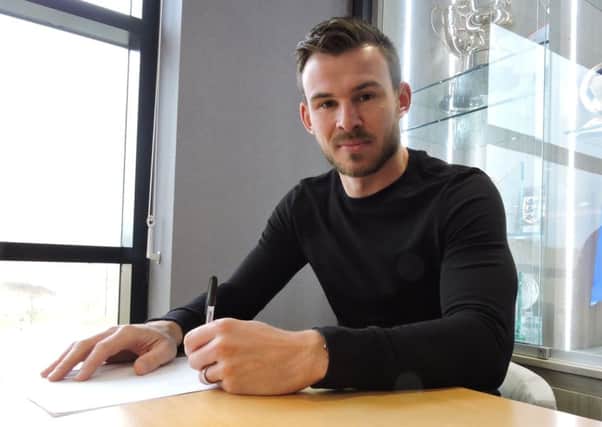 Andy Butler signs his new deal with Doncaster Rovers