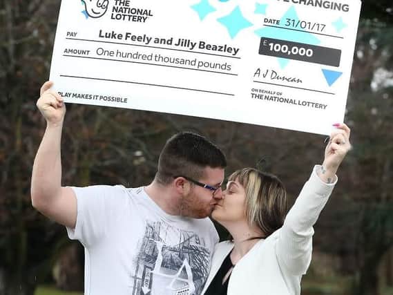 Luke and Jilly with their big cheque.