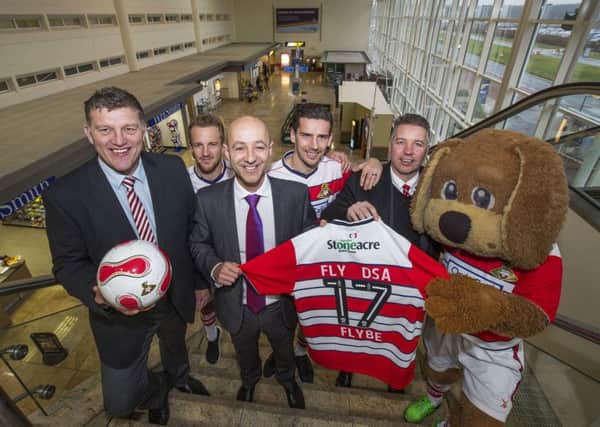 Doncaster Sheffield Airport team up with Doncaster Rovers - Steve Gill (DSA chief executive) pictured with Darren Ferguson, Gavin Baldwin, along with players James Coppinger and Mathieu Baudry and mascot Donny Dog.