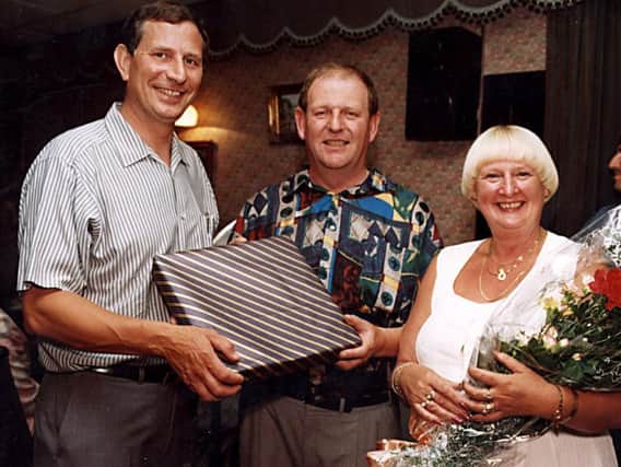 Inspector John Townend (centre) pictured with his wife Carole and Chief Inspector Brian Mordue on his retirement in 1996.