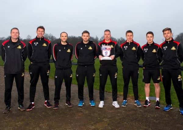Darren Ferguson, League Two Manager of the Month for January, is pictured above with his backroom team. Photo: Robbie Stephenson/JMP
