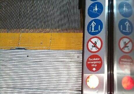The emergency stop sign and the light it appears to point to on the escalator at Frenchgate Shopping Centre in Doncaster