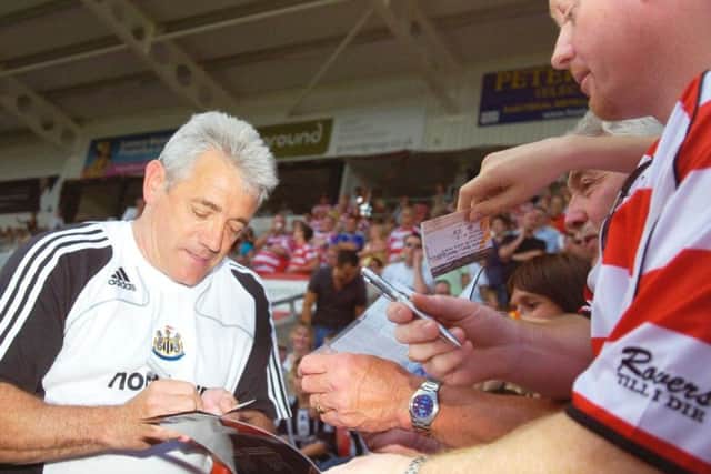 Keegan signs autographs on his return to Doncaster as Newcastle manager.