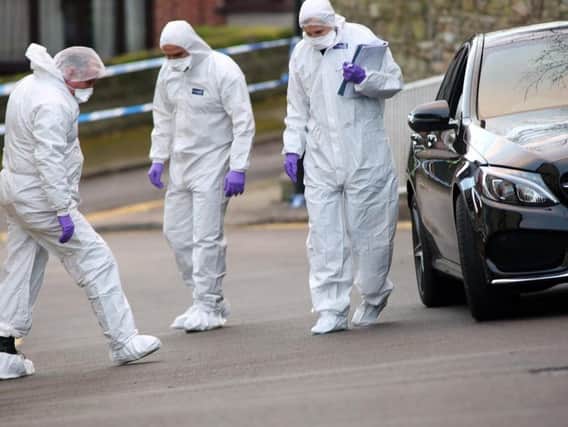 Forensics officers at the scene of the shooting (Glenn Ashley