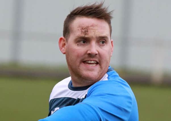 Lee Holmes scored twice for Rossington in their draw with Eccleshill United.