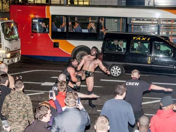 The wrestlers grapple in the middle of Arundel Gate. (Photo: Kevin Wells).