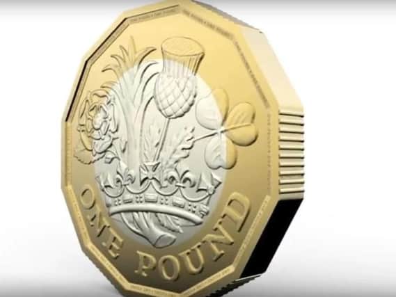 The new eight-sided pound coin.