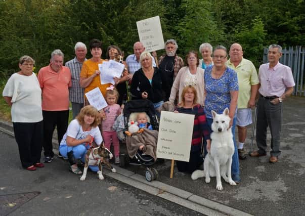 Joan and Bill Weir, Neighbourhood watch, pictured with residents from Ivor Grove and Evanston Gardens as they protest against plans to build 60 new homes on their doorsteps. Picture: Marie Caley NDFP Protest MC 2
