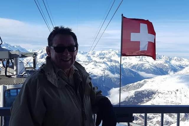Flying flag: Chris celebrates conquering Swiss summit, albeit by cable cable car, 3,000 metres up Alps (Photo: Bryn Layton)