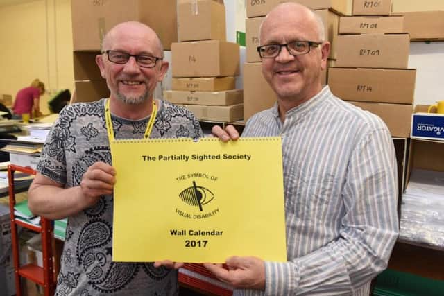 Marcus Charles and Andre Plant in the Partially Sighted Society's printing room