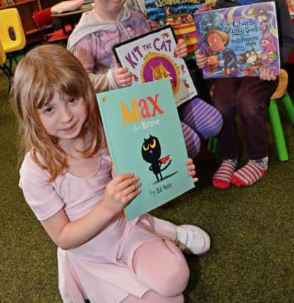 Lorna Carroll, five, Georgia Stehenson, five, her brother Jacob, seven and Marlo Freddie Davies, three, pictured enjoying the childrens books. Picture: Marie Caley NDFP Bawtry Library MC 2