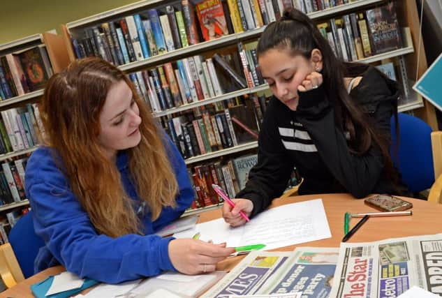 Private English and Maths tutor Emily Robinson, pictured with one of her students. Picture: Marie Caley NDFP Bawtry Library MC 4