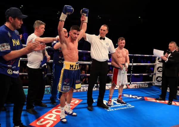 Martin J Ward celebrates victory over Maxi Hughes during the British Super-featherweight Championship bout at Manchester Arena.
