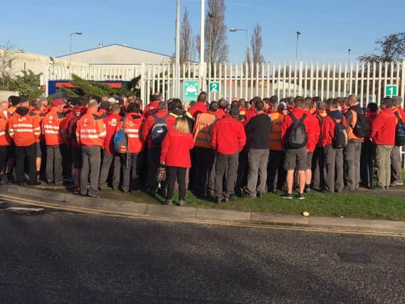 Royal Mail staff outside the Middle Bank sorting depot in Doncaster this morning