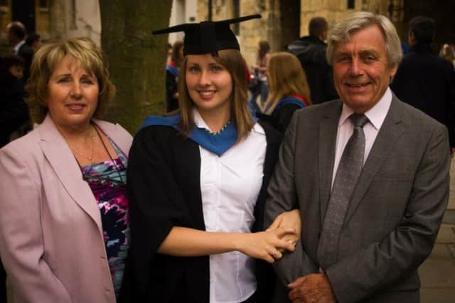 Julie with her parents Barbara and Alan at her PGCE teaching graduation